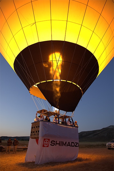 A balloon bearing the “SHIMADZU” brand symbol