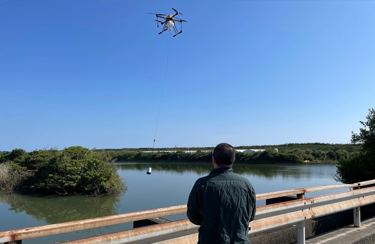 A member of Professor Yamada’s team operates the drone