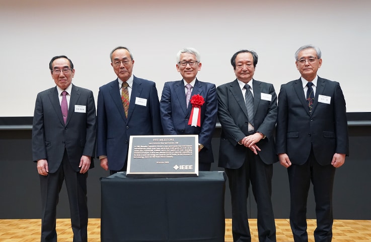 Commemorative photograph of LAMS-50K development team with the IEEE Milestone plaque. 